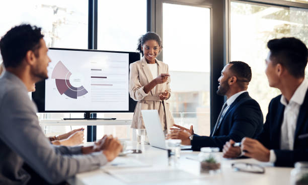now-youre-catching-on-picture-id1187648660 Shot of a young businesswoman delivering a presentation to her colleagues in the boardroom of a modern office